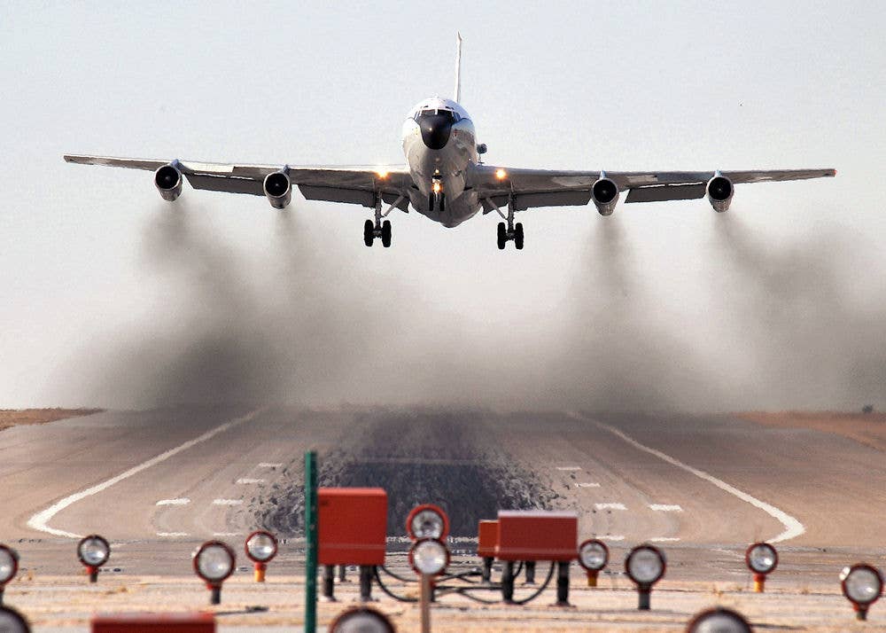 A WC-135W Constant Phoenix aircraft performs touch 'n go landing exercises at Offutt Air Force Base, Neb. <em>Wikimedia Commons</em>