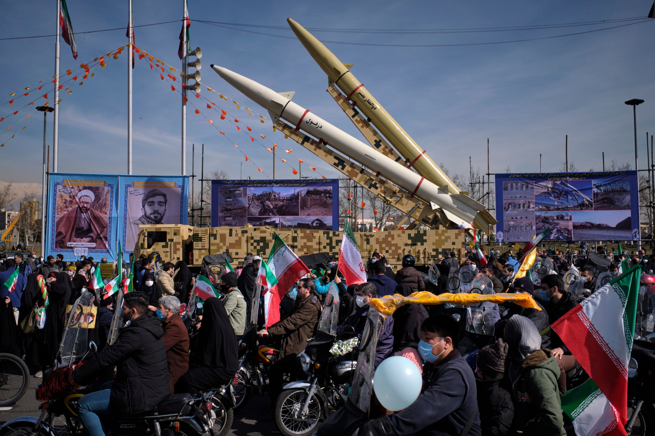 Iran-made, Dezful medium range ballistic missile (Bottom) and Zolfaghar road-mobile single-stage solid-propelled liquid fueled missile are pictured in the Azadi (Freedom) square during a rally to commemorate the 42nd Victory anniversary of the Islamic Revolution, that held with motorcycles amid the new coronavirus disease (COVID-19) outbreak in Iran, in Tehran on February 10, 2021, on February 10, 2021.  (Photo by Morteza Nikoubazl/NurPhoto via Getty Images)