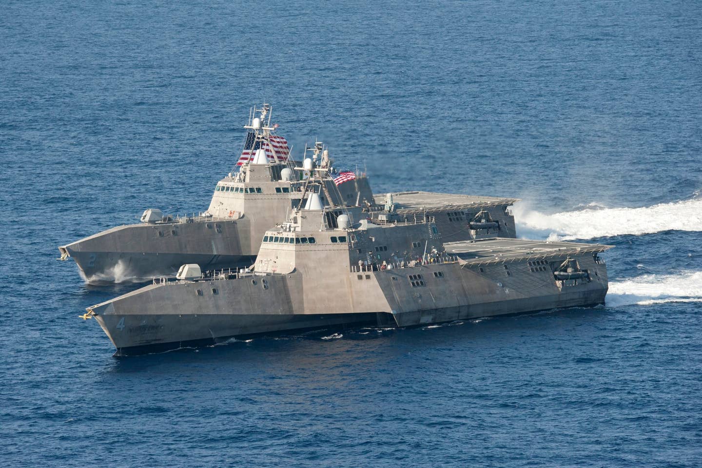 The Littoral Combat Ships USS <em>Independence</em> (LCS-2), back, and USS <em>Coronado</em> (LCS-4) underway in the Pacific Ocean in April 2014. <em>U.S. Navy photo by Chief Mass Communication Specialist Keith DeVinney/Released</em>