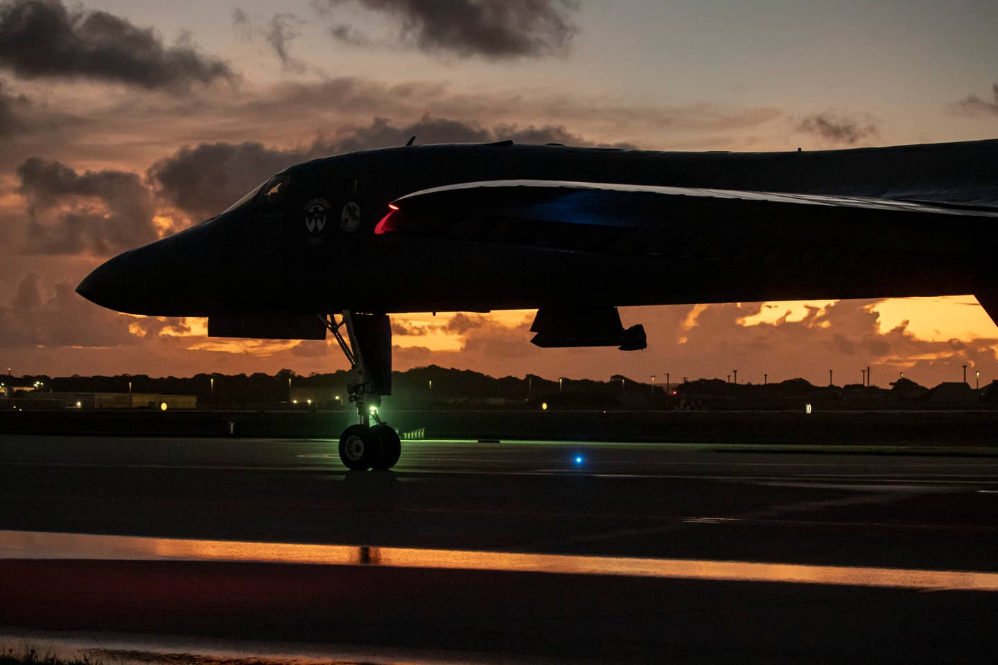 A B-1B prepares to park as the sun sets at Anderson Air Force Base, Guam, June 8, 2022. <em>U.S. Air Force photo by Tech. Sgt. Chris Hibben</em>