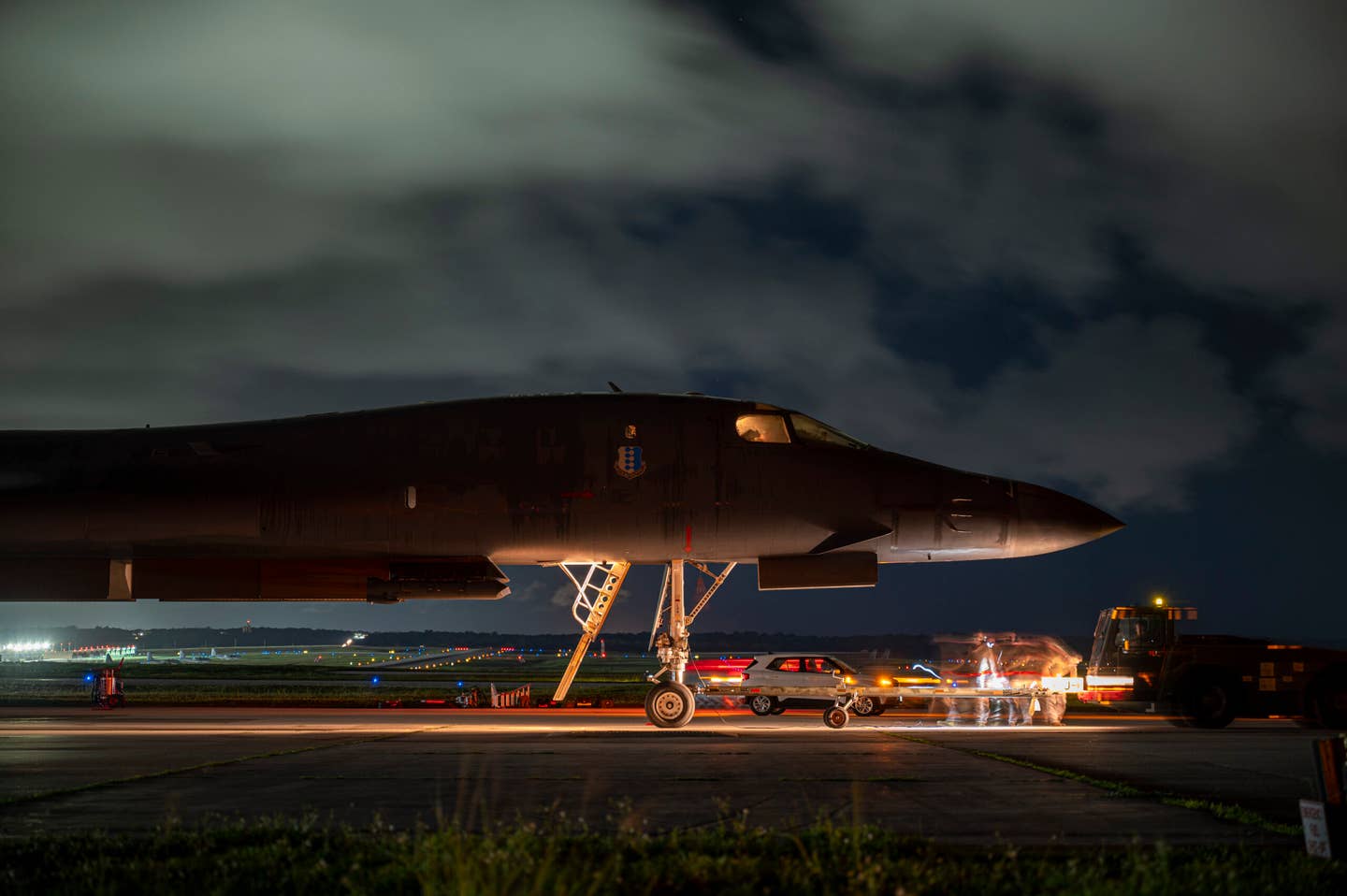 Service members from the 34th Aircraft Maintenance Unit perform post-flight checks on a B-1B of the 34th Expeditionary Bomb Squadron, at Andersen Air Force Base. The Lancer had just returned from a Bomber Task Force mission with the Royal Australian Air Force, June 20, 2022. <em>U.S. Air Force photo by Master Sgt. Nicholas Priest</em>