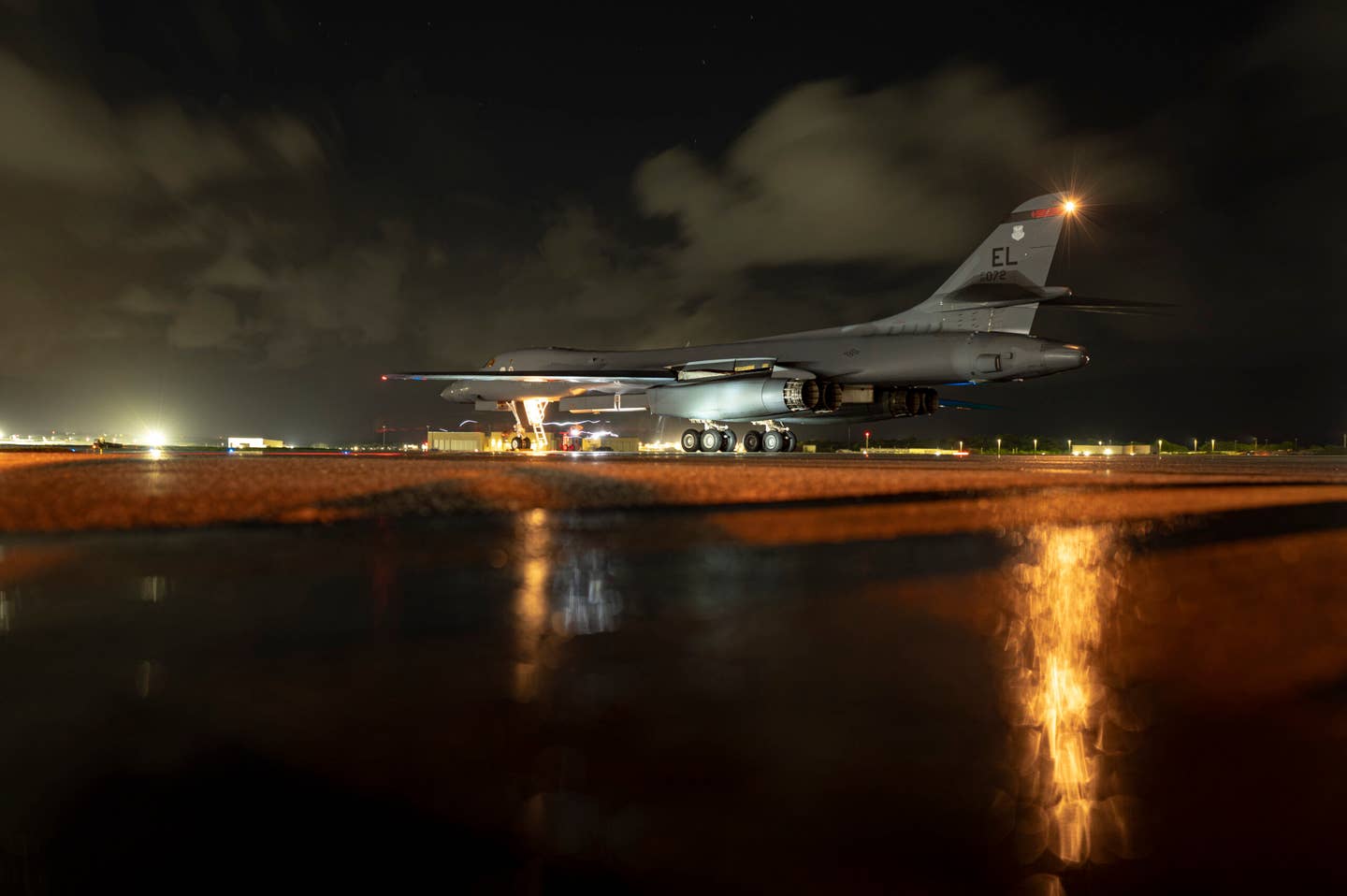 U.S. Air Force service members, assigned to the 34th Aircraft Maintenance Unit, inspect a B-1B at Andersen, after a Bomber Task Force mission, June 25, 2022. <em>U.S. Air Force photo by Master Sgt. Nicholas Priest</em>