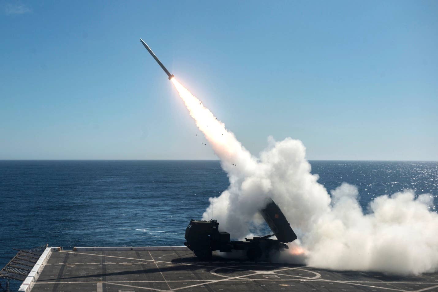 HIMARS is fired from the flight deck of the amphibious transport dock ship USS <em>Anchorage</em>. <em>Credit: Mass Communication Specialist 2nd Class Matthew Dickinson/U.S. Navy</em>