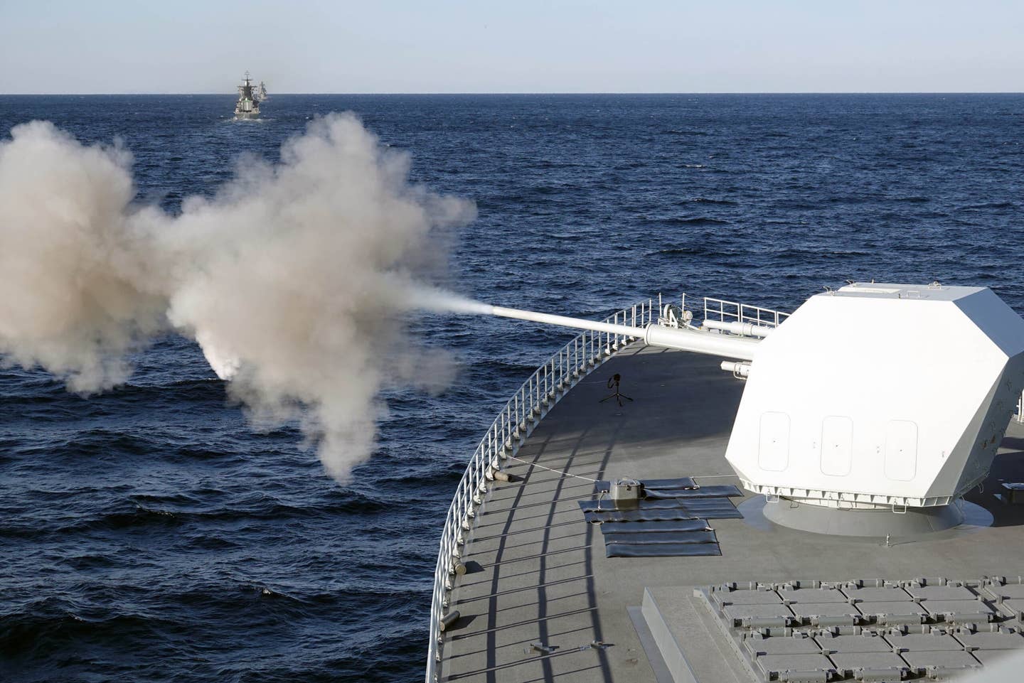 The main gun of Chinese guided-missile destroyer Nanchang attacks target during the China-Russia 'Joint Sea-2021' military drill near the Peter the Great Gulf on October 15, 2021 in Russia. (Photo by Sun Zifa/China News Service via Getty Images)