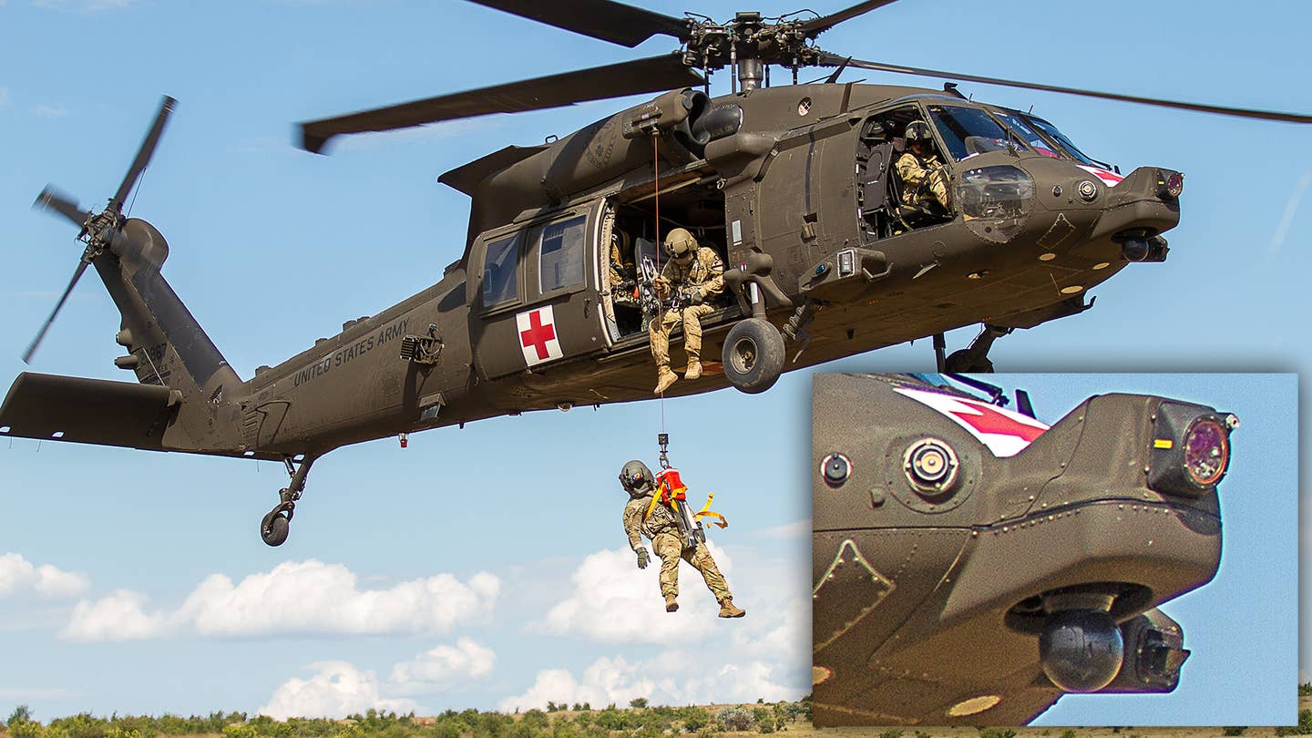 BABADAG TRAINING AREA, Romania-- An HH-60 MEDEVAC helicopter and crew assigned to C Co, 2-227 GSAB hoist a simulated casualty during personnel recovery training with the U.K. 140th Expeditionary Air Wing, July 12, 2022.



Regular interoperability training with NATO partners and allies builds trust and readiness, increasing the capacity for deterrence and defense. (U.S. Army photo by Capt. Taylor Criswell)