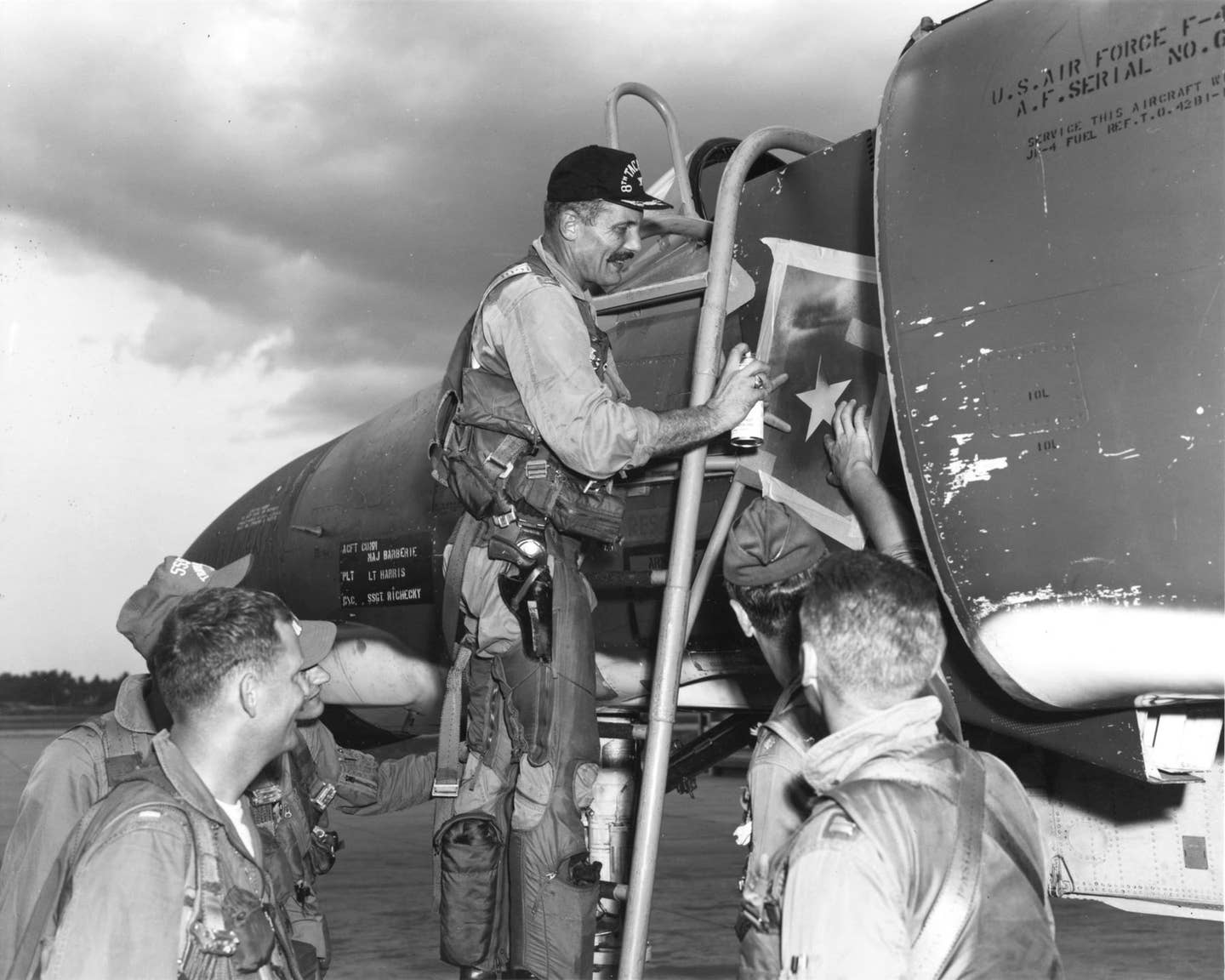 Col. Robin Olds adds a victory star on the F-4 he was flying on May 4, 1967, when he shot down a MiG-21. This was his second kill of the war. <em>U.S. Air Force photo</em><br><a href="https://www.nationalmuseum.af.mil/Visit/Museum-Exhibits/Fact-Sheets/Display/Article/196007/brig-gen-robin-olds-combat-leader-and-fighter-ace/undefined"></a>