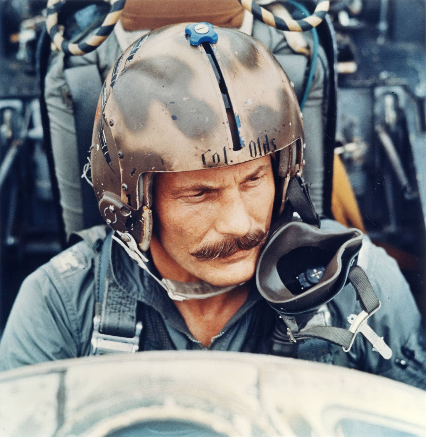 Col. Robin Olds wearing the distinctive camouflaged flight helmet that is now on display in the Southeast Asia War Gallery at the National Museum of the U.S. Air Force. <em>U.S. Air Force photo</em><br><a href="https://www.nationalmuseum.af.mil/Visit/Museum-Exhibits/Fact-Sheets/Display/Article/196007/brig-gen-robin-olds-combat-leader-and-fighter-ace/undefined"></a>
