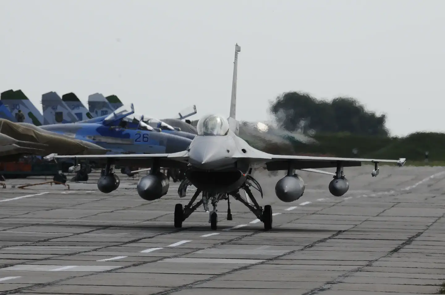 A U.S. Air Force F-16C taxis past Ukrainian MiG-29s and Su-27s at Migorod Air Base, Ukraine, July 2011, during Exercise Safe Skies 2011.&nbsp;<em>U.S. AIR FORCE</em>