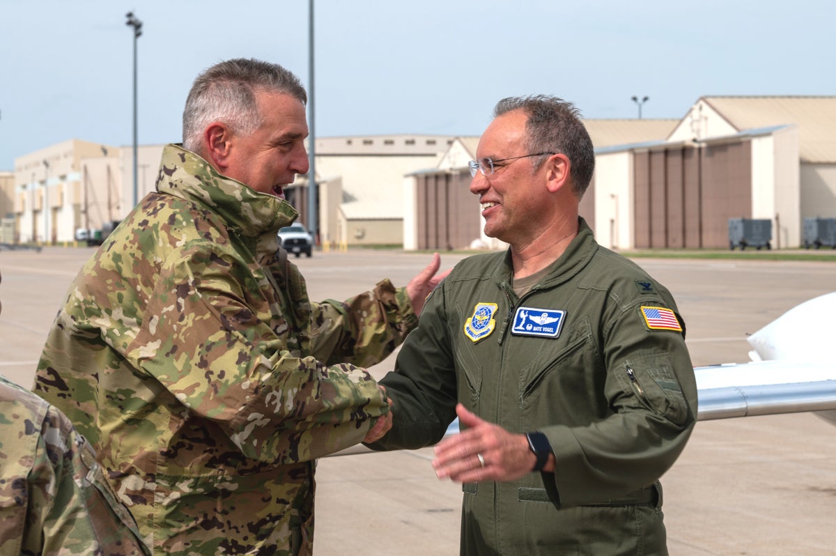 Colonel Nate Vogel (right), 22nd Air Refueling Wing commander, greets Gen. Mike Minihan, Commander of Air Mobility Command, April 27, 2022, at McConnell Air Force Base, Kansas. The AMC command team visited McConnell and toured various organizations as well as received mission briefs from McConnell’s leadership and Airmen. AMC leadership also praised Team McConnell for their hard work and dedication in the advancement of aerial refueling. (U.S. Air Force photo by Airman Brenden Beezley)