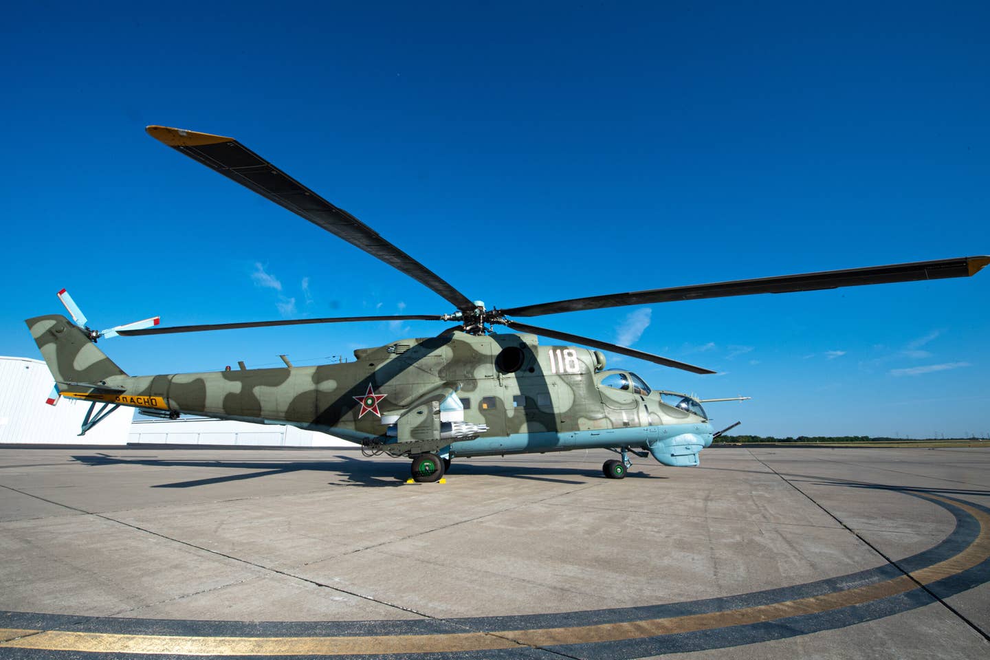 An Mi-24 Hind sits at Lancaster Airport in Lancaster, Texas, June 29, 2022. The Mi-24 Hind was used during the 41st Rescue Squadron’s air combat maneuver training with the HH-60W Jolly Green II helicopter.  (U.S. Air Force photo by Airman 1st Class Courtney Sebastianelli)