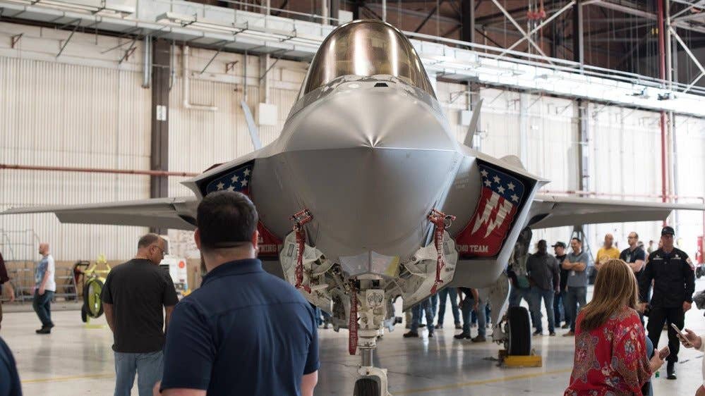 Members of the Oklahoma City Air Logistics Complex Heavy Maintenance Center get an up close look at an Air Force F-35 Lightning II Demonstration Team aircraft at Tinker Air Force Base, Oklahoma, May 25, 2021. (U.S. Air Force photo by Paul Shirk)