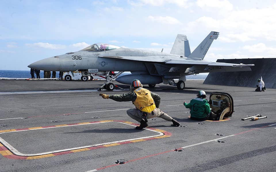A F/A-18 Super Hornet preparing for takeoff from an aircraft carrier. <em>Boeing</em>