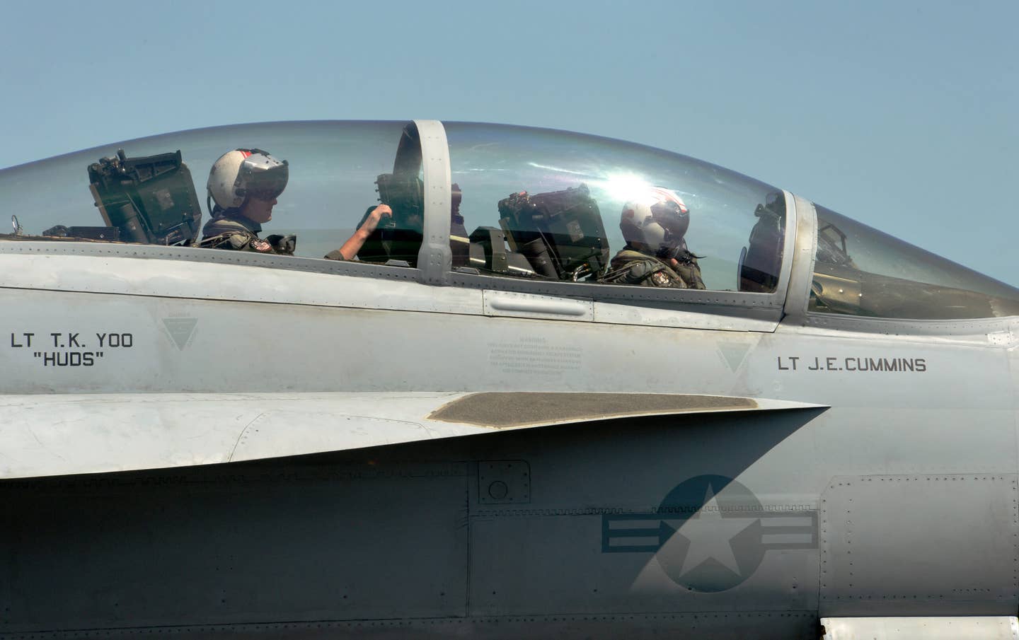 The crew of a U.S. Navy F/A-18F based out of Naval Air Station Lemoore, California, prepares for a dissimilar aircraft combat training (DACT) sortie at Portland Air National Guard Base, Portland, Oregon, in 2019. <em>Air National Guard photo by Master Sgt. John Hughel, 142nd Fighter Wing Public Affairs</em>