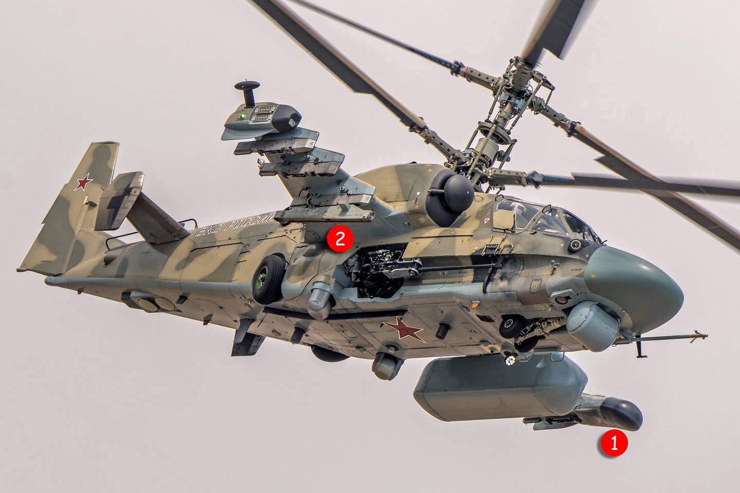 The first modernized Ka-52M helicopter fitted with the AS-BPLA datalink pod (1) and APU-305 rail (2) for the LMUR missile. <em>Piotr Butowski</em>