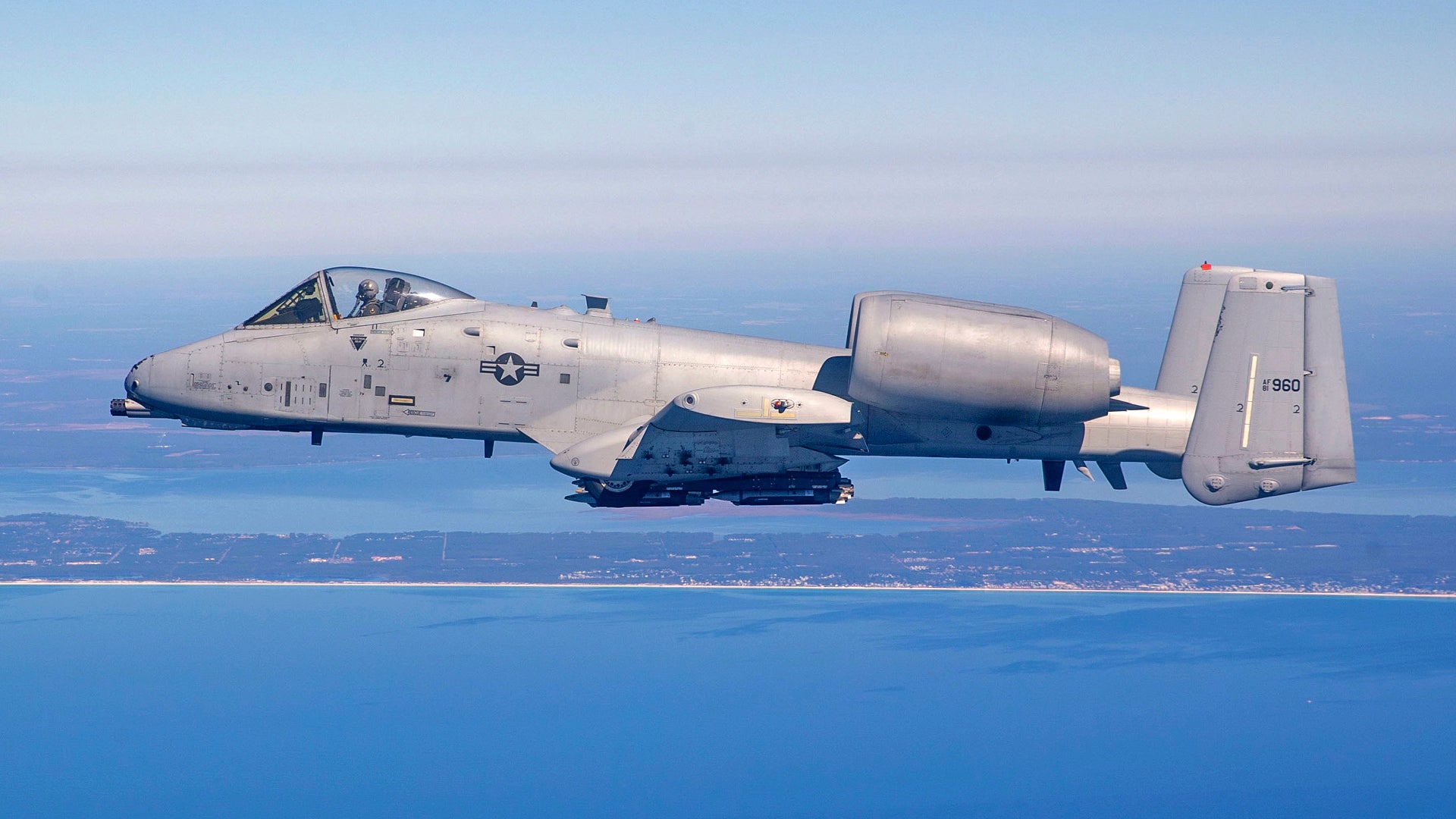 Maj Eric Hickernell from the 40th Flight Test Squadron flies an A-10C Thunderbolt II with Small-Diameter Bombs during a test near Eglin Air Force Base, Fla, Feb 9, 2022. The 96th Test Wing executes developmental tests of the A-10C, and improves its capability of carrying precision guided munitions and unguided munitions.  (U.S. Air Force Photo by Tech. Sgt. John Raven)