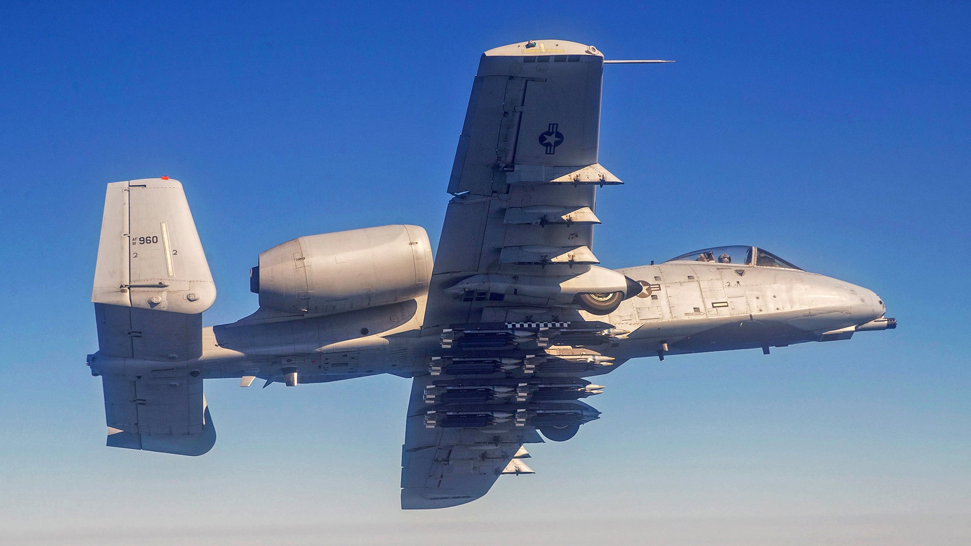 Maj Eric Hickernell from the 40th Flight Test Squadron flies an A-10C Thunderbolt II with Small-Diameter Bombs during a test near Eglin Air Force Base, Fla, Feb 9, 2022. The 96th Test Wing executes developmental tests of the A-10C, and improves its capability of carrying precision guided munitions and unguided munitions.  (U.S. Air Force Photo by Tech. Sgt. John Raven)