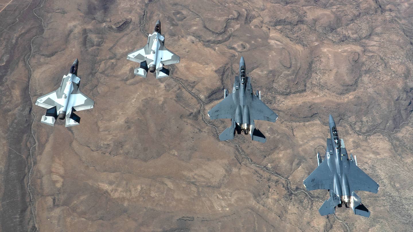 Aggressor F-35As and operational test F-15Es. <em>USAF/TSgt Alexandre Montes</em>