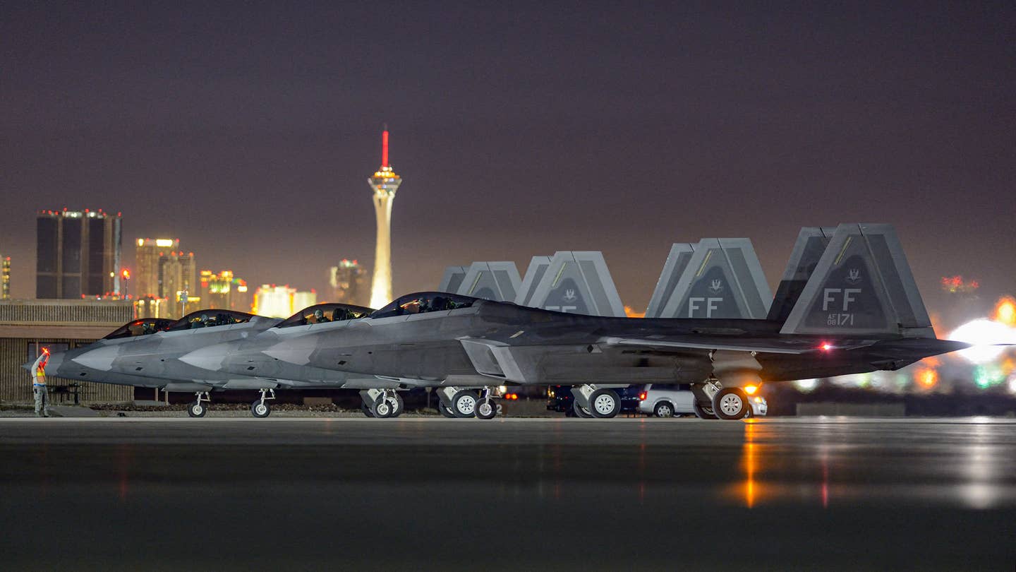 F-22 Raptors are prepared for a night mission during Exercise Red Flag. Jamie Hunter