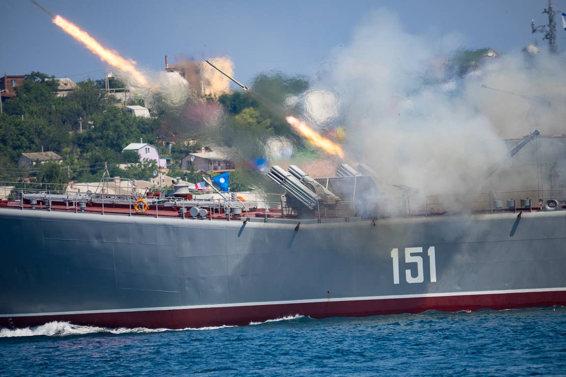 The Russian Navy <em>Ropucha</em> class&nbsp;landing ship <em>Azov</em> launches rockets during a firepower demonstration at the Navy Day in Sevastopol in 2015. <em>sovraskin/Wikimedia Commons</em>