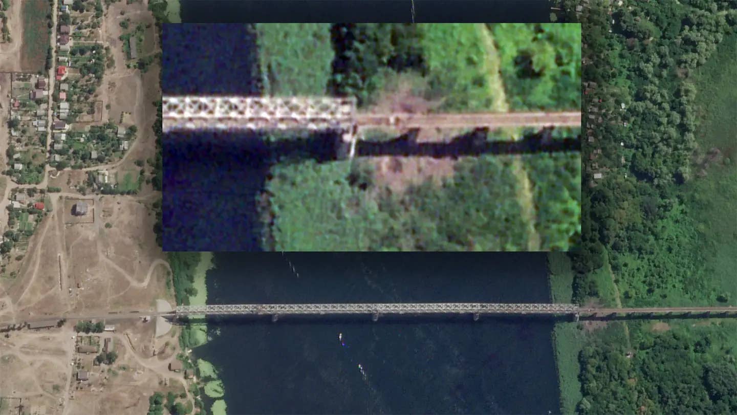 The rail bridge was struck by GMLRS rockets in recent days, putting it out of action, just like its roadway counterpart four miles to the west. <em> PHOTO © 2022 PLANET LABS INC. ALL RIGHTS RESERVED. REPRINTED BY PERMISSION.</em><br>
