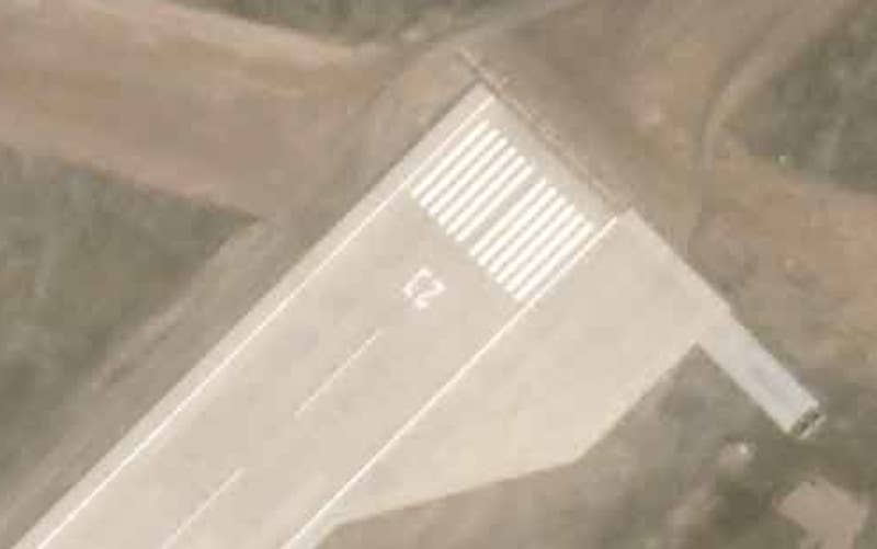 What may additional heavy equipment on a pad attached to the turnaround area at the northern end of the runway. <em>PHOTO © 2022 PLANET LABS INC. ALL RIGHTS RESERVED. REPRINTED BY PERMISSION</em>