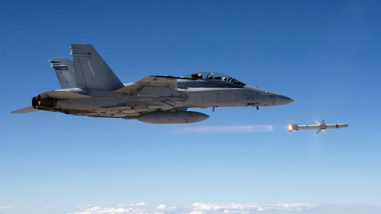 A F/A-18 Hornet fires a HARM derivative during a test. (Northrop Grumman)
