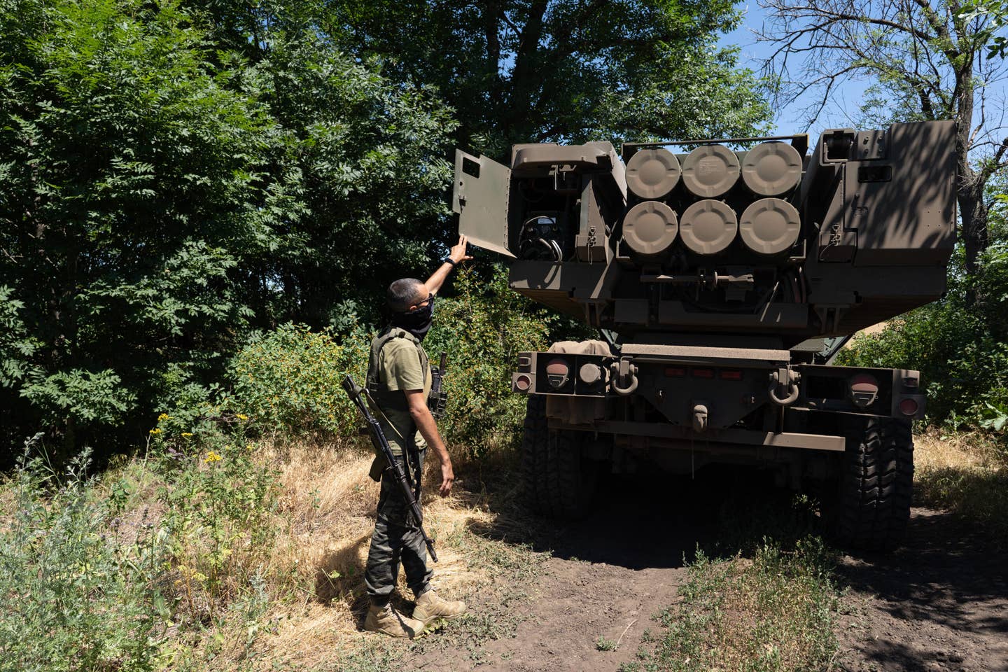 Kuzia, the commander of the unit, shows the Guided Multiple Launch Rocket Systems (GMLRS) munitions on an M142 High Mobility Artillery Rocket Systems or HIMARS in Eastern Ukraine. (Photo by Anastasia Vlasova for The Washington Post via Getty Images)