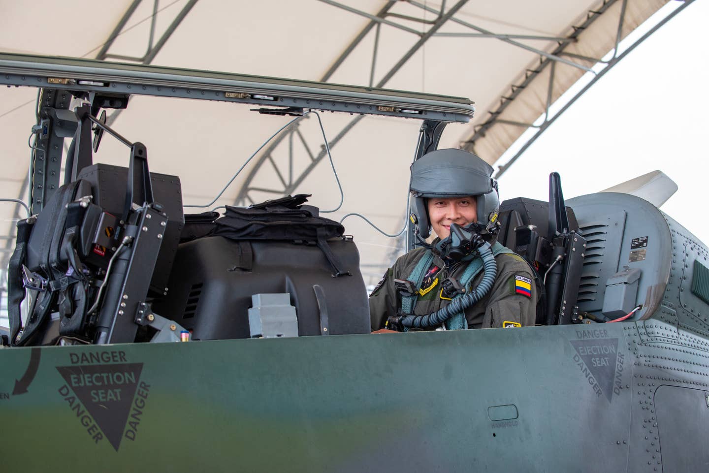 Colombian Air Force Carreno “Tifon”, a copilot, poses for a photograph before an experimentation flight in the AT-6E Wolverine at Moody Air Force Base, Georgia, April 14, 2022. The flight focused on digitally tracking friendly forces and potential enemy movement using AERONet software. <em>U.S. Air Force photo by Airman 1st Class Courtney Sebastianelli</em>