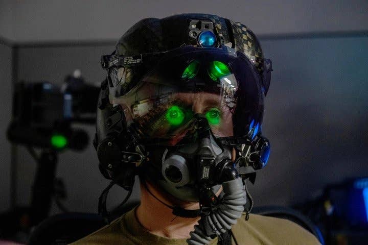 U.S. Air Force Tech. Sgt. Anthony Farnsworth, 419th Operations Support Squadron, poses for a photo to demonstrate the F-35 Generation III Helmet-Mounted Display at Hill Air Force Base, Utah, on July 10, 2021. (U.S. Air Force photo by Senior Airman Erica Webster)