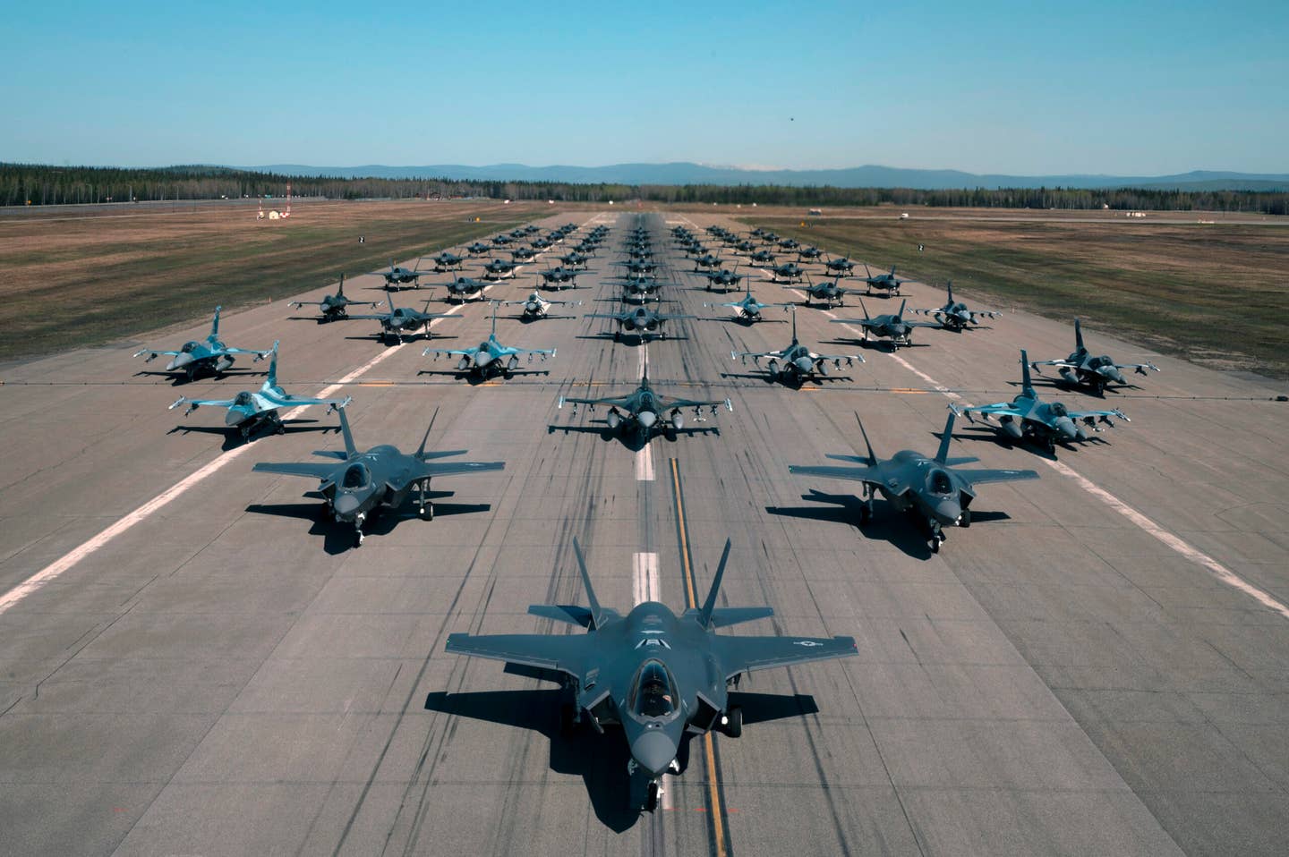 A formation of F-35A Lightning IIs and F-16 Fighting Falcons assigned to the 354th Fighter Wing assemble during a routine readiness exercise at Eielson Air Force Base, Alaska, May 20, 2022. (U.S. Air Force photo by Airman 1st Class Elizabeth Schoubroek)