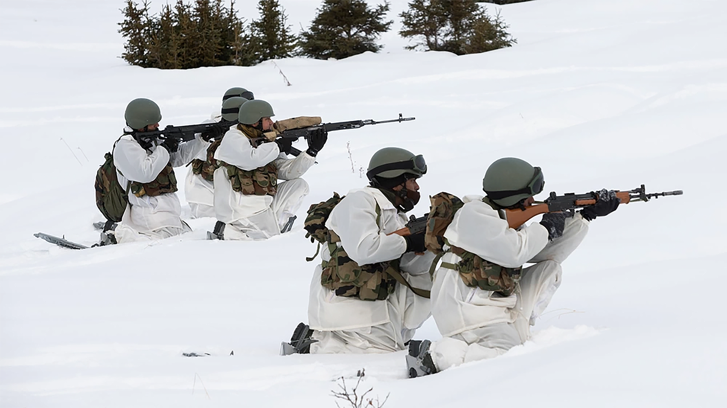Indian Army soldiers assigned to the 7th Battalion, the Madras Regiment, advance on their objective while conducting a joint field training exercise for Yudh Abhyas 2021. <em>Credit: Alejandro Peña/U.S. Air Force</em>