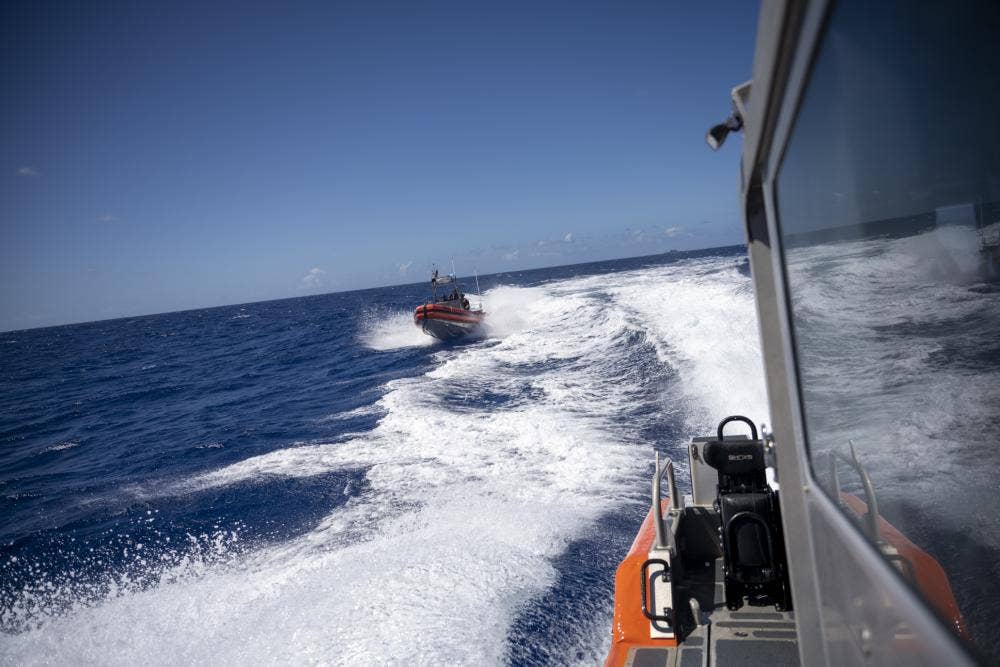 A 26-foot over-the-horizon boat from U.S. Coast Guard Legend-class cutter <em>Midgett </em>pursues a simulated non-compliant vessel during RIMPAC 2022. (U.S. Navy photo)