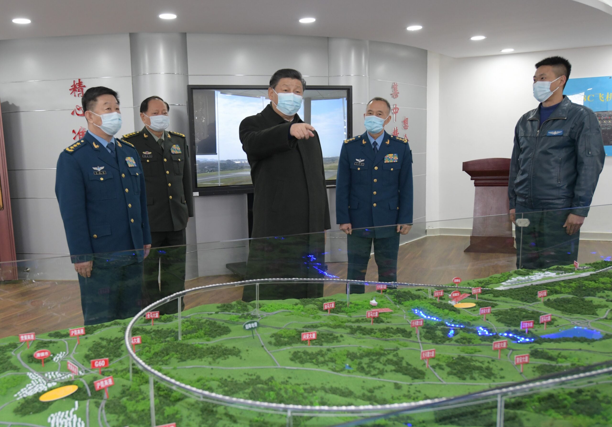 GUIYANG, Feb. 4, 2021 -- Chinese President Xi Jinping, also general secretary of the Communist Party of China CPC Central Committee and chairman of the Central Military Commission CMC, learns about the education and training of soldiers and officers on Feb. 4, 2021.
  Xi on Thursday inspected an aviation division of the Air Force stationed in southwestern Guizhou Province ahead of the Spring Festival, or the Chinese Lunar New Year.
  Xi extended New Year greetings to all soldiers and officers of the People's Liberation Army, armed police force, civilian personnel in the military, militia and reserve forces, on behalf of the CPC Central Committee and the CMC. (Photo by Li Gang/Xinhua via Getty) (Xinhua/Li Gang via Getty Images)