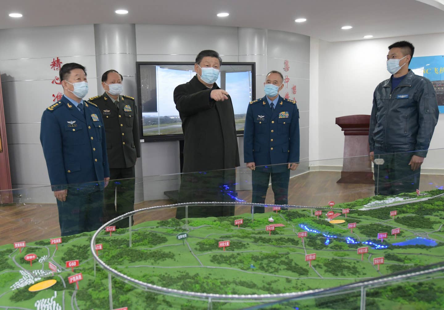 Chinese President Xi Jinping, also general secretary of the Communist Party of China CPC Central Committee and chairman of the Central Military Commission CMC, learns about the training of soldiers and officers during an inspection of an aviation division of the PLA Air Force in southwestern Guizhou Province. <em>Xinhua/Li Gang via Getty Images</em>