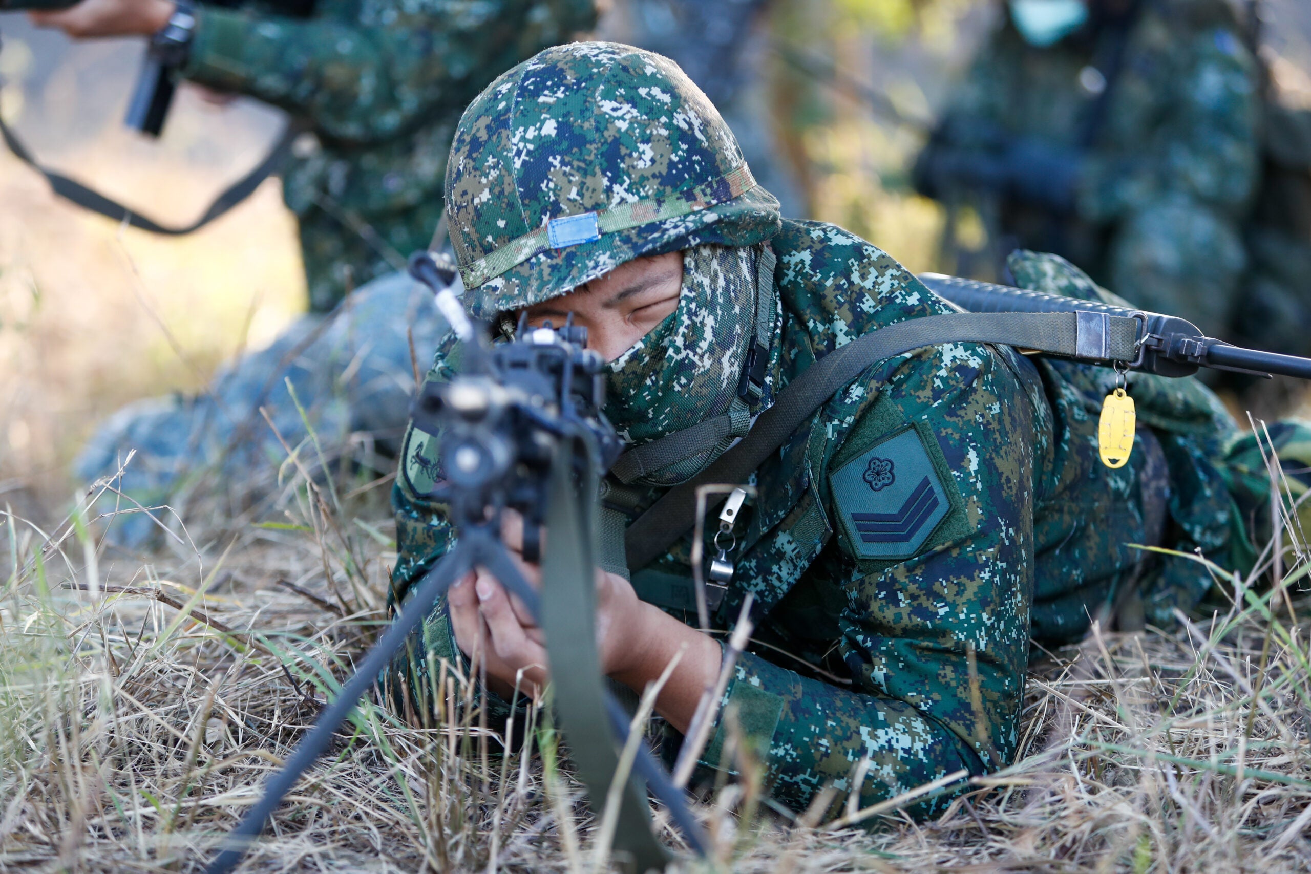 Soldiers holding machine guns and grenade launchers  in position , during a shore defense operation as part of a military exercise simulating the defense against the intrusion of Chinese military, amid rising tensions between Taipei and Beijing, in Tainan, Taiwan, 11 November 2021. The self governing island has been receiving increasing assistance from the US while building better relations with the UK, Australia, France and other European countries including Lithuania, Czech Republic, Poland and so on. (Photo by Ceng Shou Yi/NurPhoto via Getty Images)