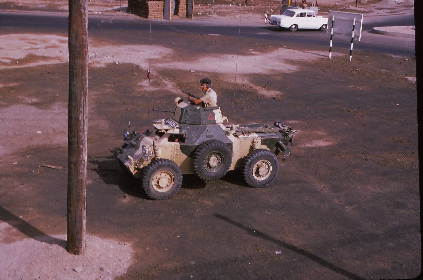 A Ferret scout car of the Queens Dragoon Guards returns from escorting military vehicles in the Aden Governorate in 1967, while it was still under British rule. <em>Brian Harrington Spier/Wikimedia Commons</em>