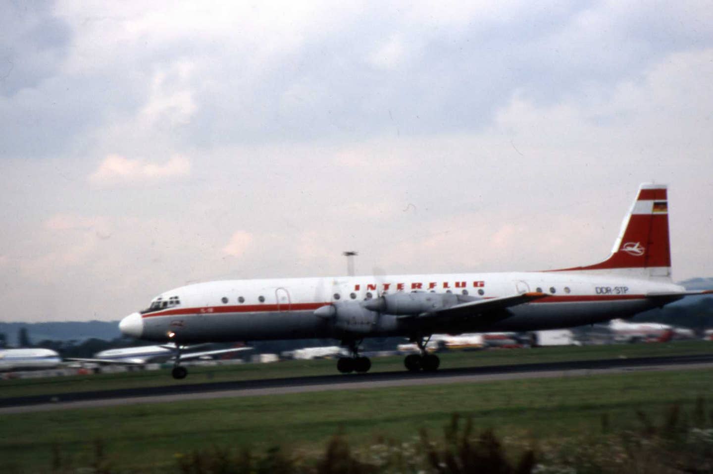 Photo of an Ilyushin Il-18 turboprop jetliner taken sometime in the 1970s/80s. <em>Credit: MercerMJ/Wikimedia Commons</em>