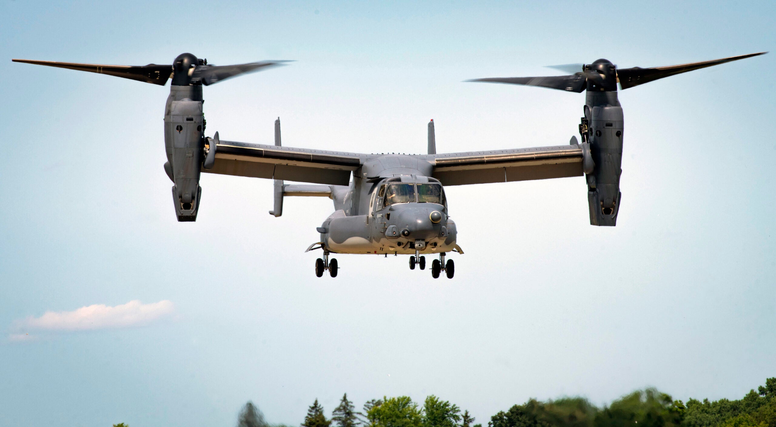 A CV-22 Osprey assigned to Air Force Special Operations Command prepares to land during an aerial demonstration at Wittman Regional Airport, Wis., July 30, 2021. With the various Air Force Special Operations Command aircraft and personnel in attendance, AFSOC brings specialized airpower and competitive advantage to the future warfighting environment. (U.S. Air Force photo by Senior Airman Miranda Mahoney)