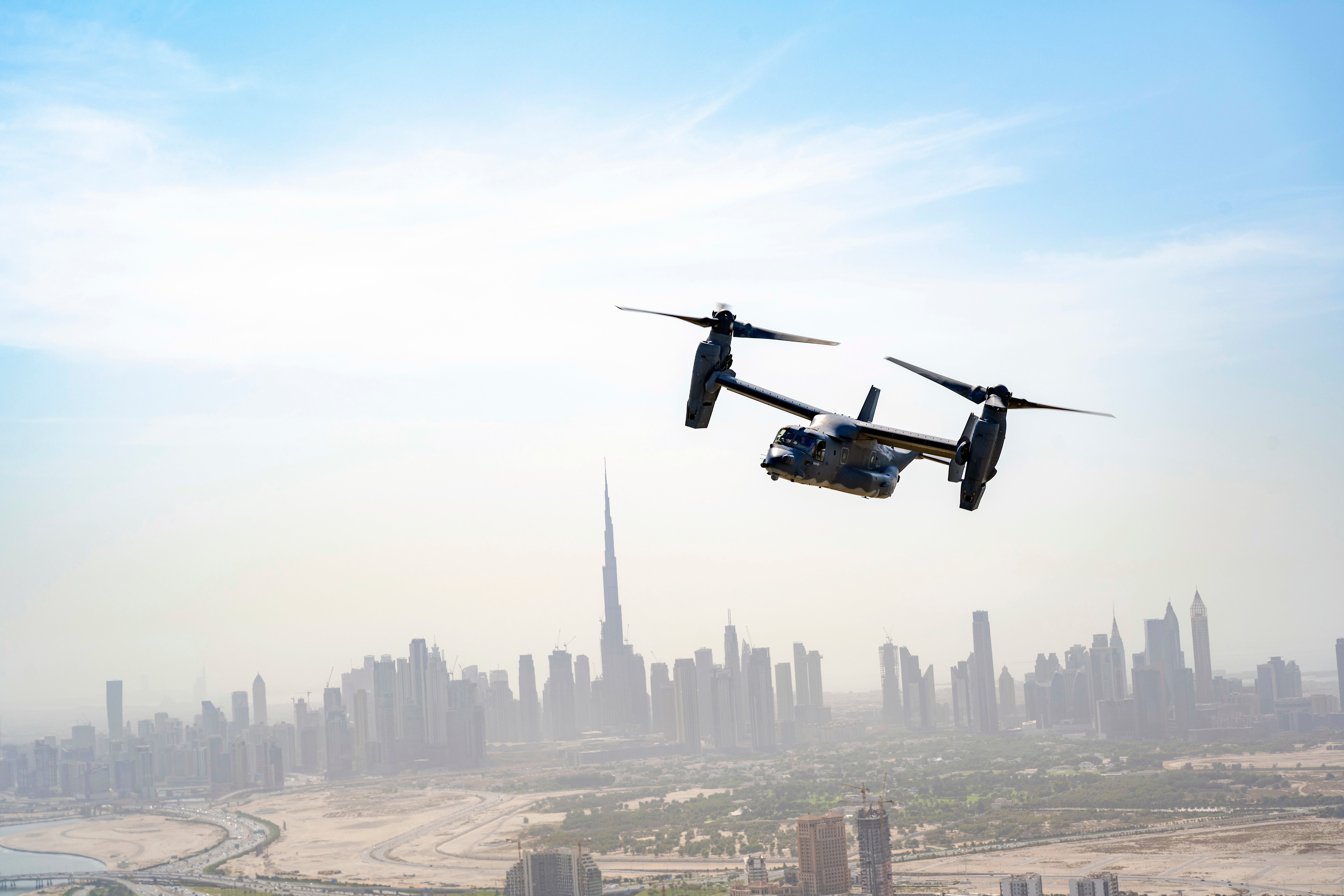 A U.S. Air Force CV-22 Osprey assigned to the 8th Expeditionary Special Operations Squadron, takes part in a photo chase mission around Dubai, United Arab Emirates, Sept 16, 2021. The mission of the CV-22 is to conduct long-range infiltration, exfiltration and resupply missions for special operations forces.  The CV-22 Osprey is a tiltrotor aircraft that combines the vertical takeoff, hover, and vertical landing qualities of a helicopter with the long-range, fuel efficiency, and speed characteristics of a turboprop aircraft.  (U.S. Air Force photo by Master Sgt. Wolfram M. Stumpf)