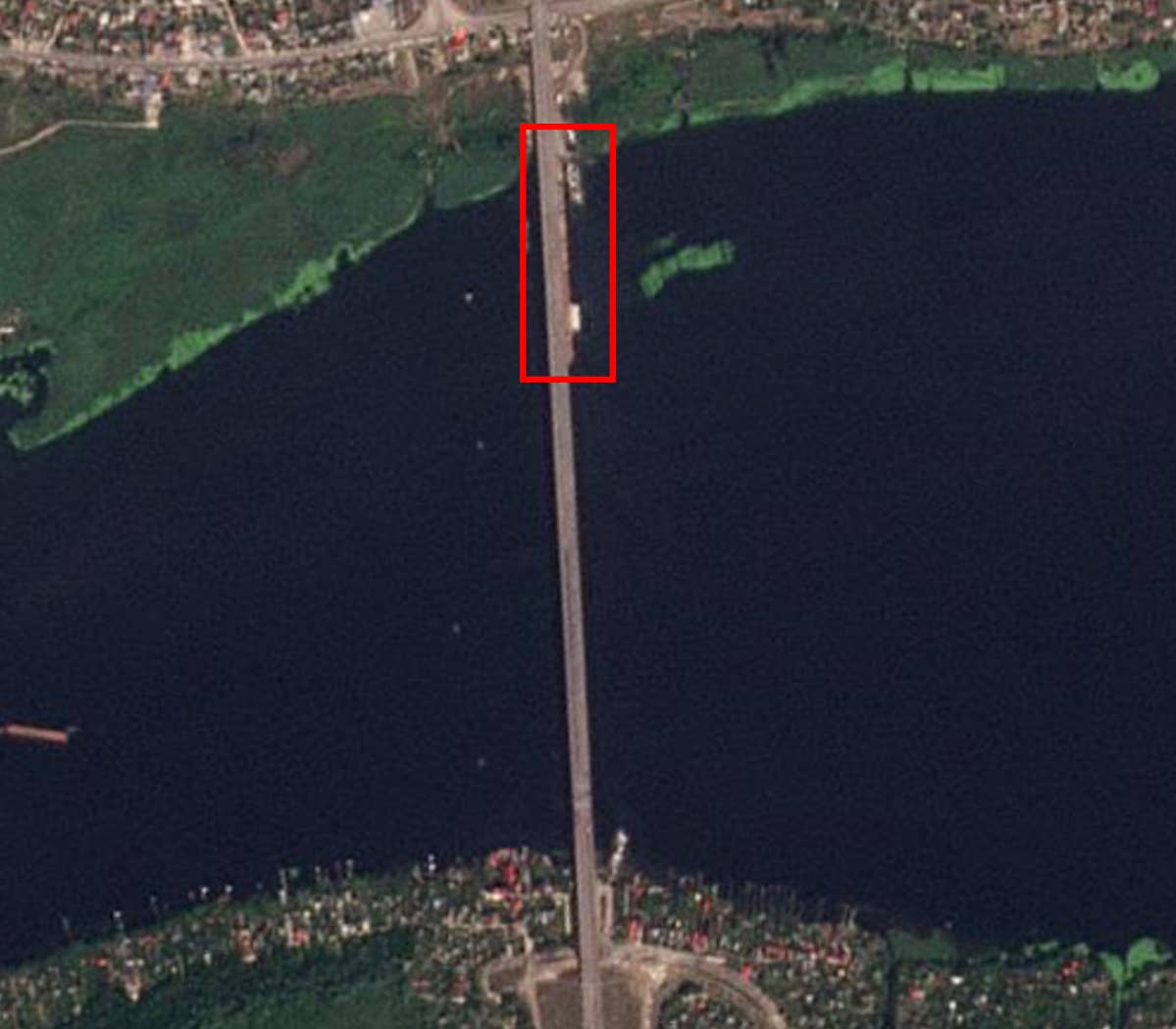 The beginning of a pontoon bridge can be seen alongside the Antonovsky Bridge on the north bank of the Dnipro River. <em>PHOTO © 2022 PLANET LABS INC. ALL RIGHTS RESERVED. REPRINTED BY PERMISSION</em>