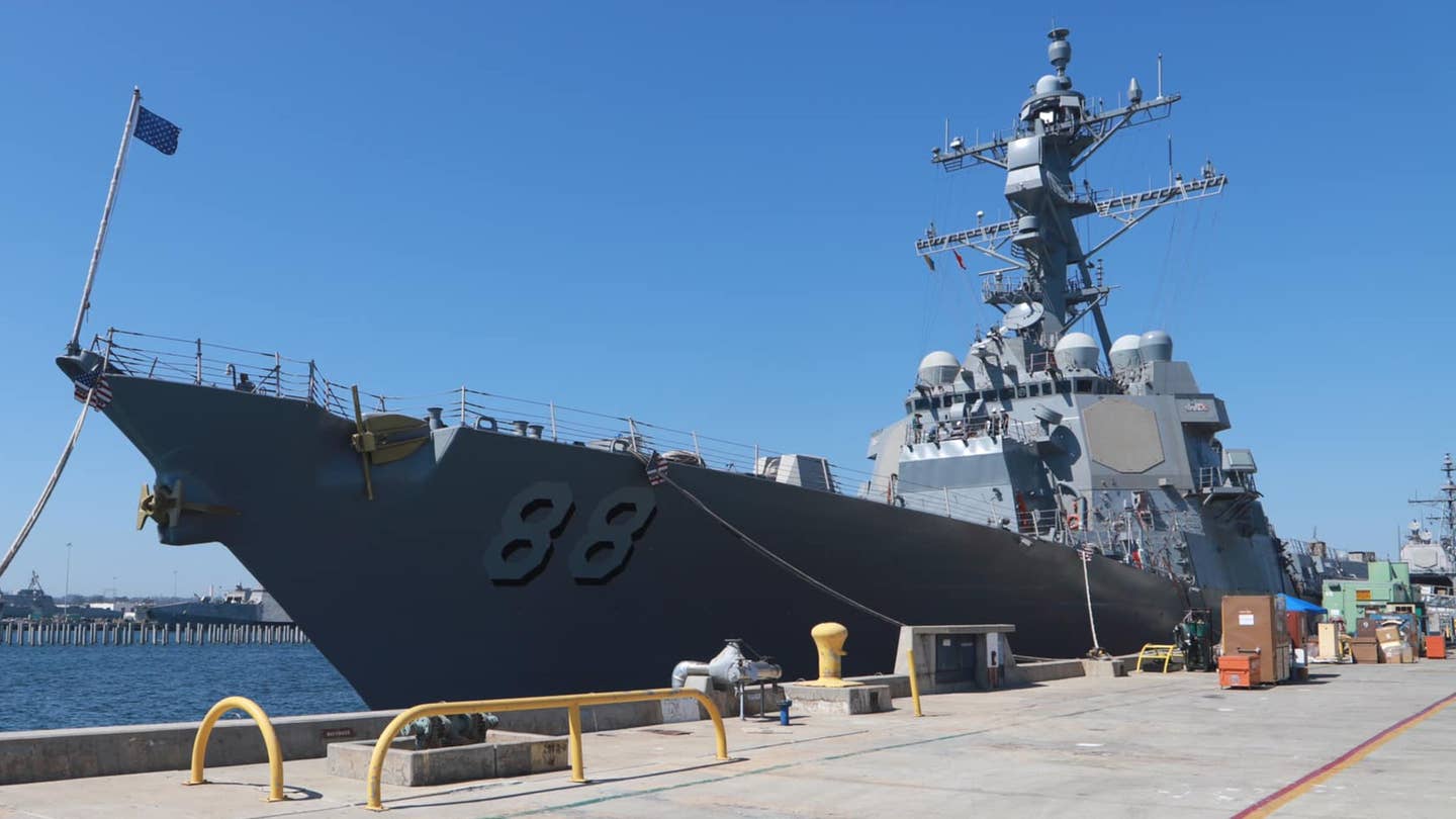 USS <em>Preble</em> pierside in San Diego in July 2022. HELIOS can be seen on a platform immediately in front of the main superstructure.
