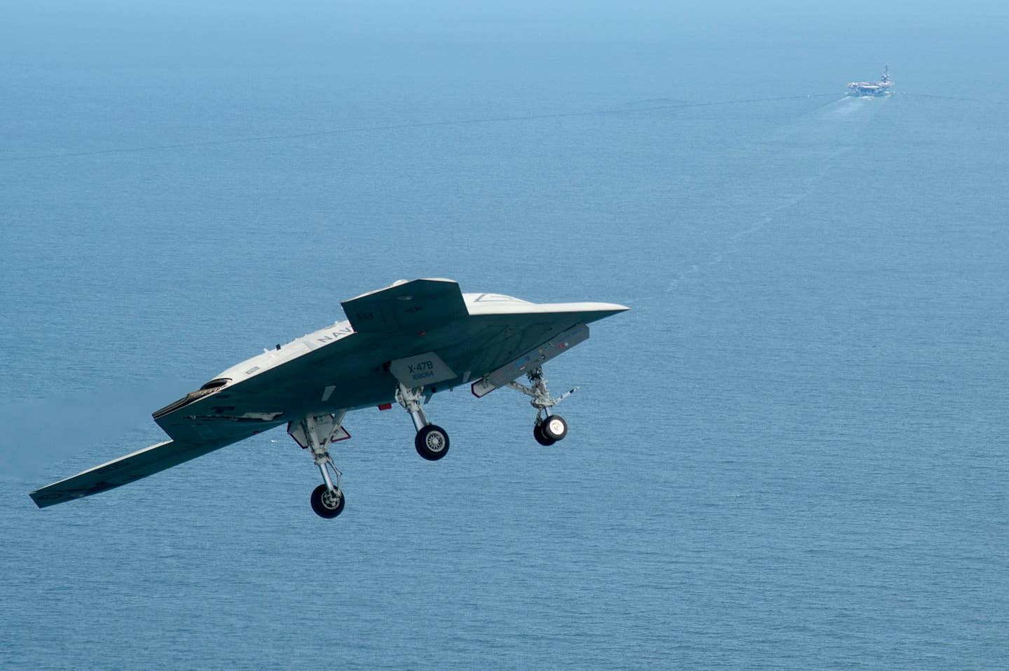 An X-47B Unmanned Combat Air System demonstrator about to enter the groove during an approach to the aircraft carrier USS <em>George H.W. Bush </em>(CVN 77). <em>George H.W. Bush</em> was the first aircraft carrier to successfully catapult launch an unmanned aircraft from its flight deck. <em>USN photo by Erik Hildebrandt</em>