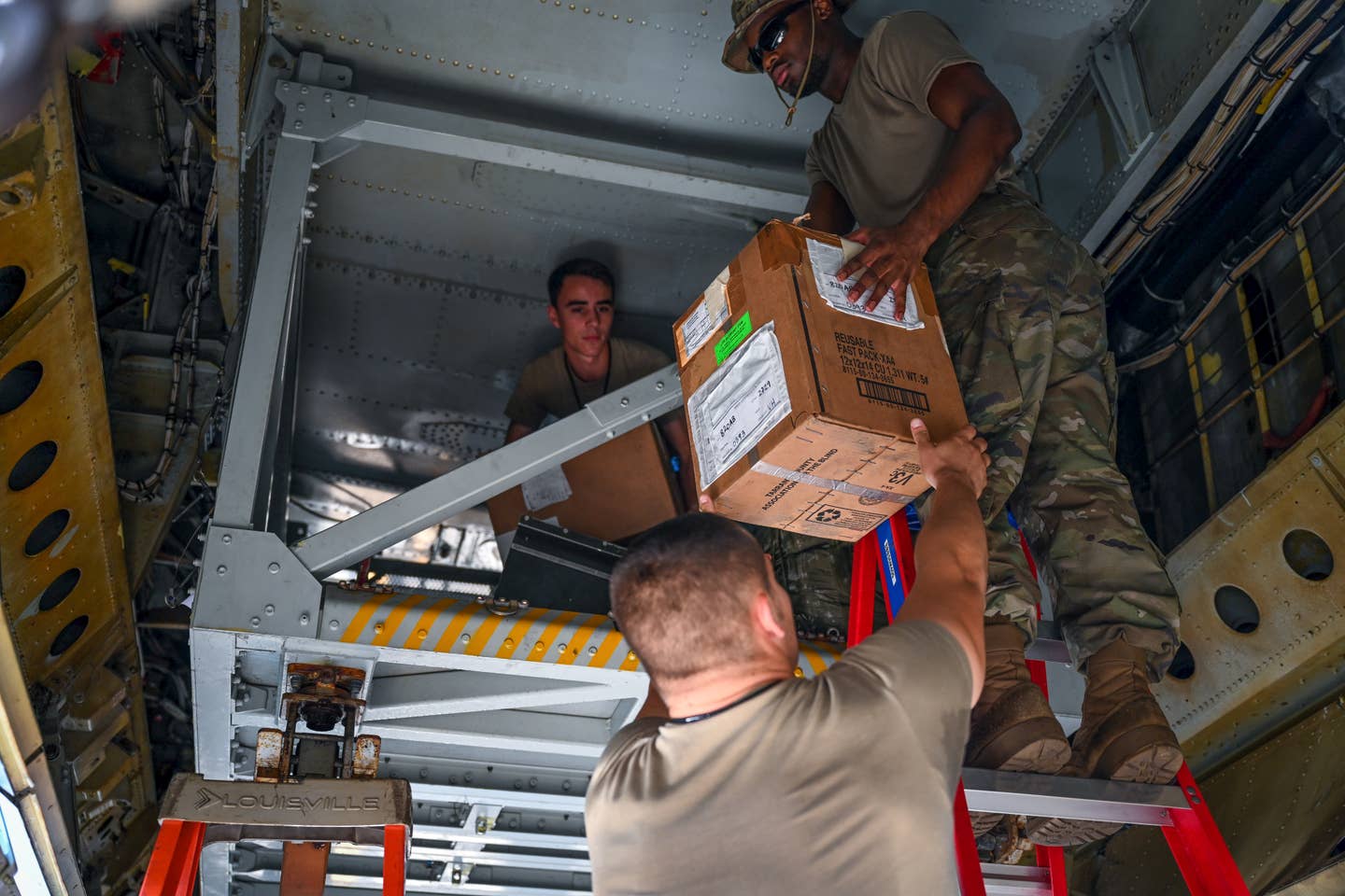 Airmen from the 2nd Aircraft Maintenance Squadron unload a B-52 On-Board Cargo System after an Agile Combat Employment Exercise at Barksdale Air Force Base <em>Credit: Airman Nicole Ledbetter/U.S. Air Force</em>