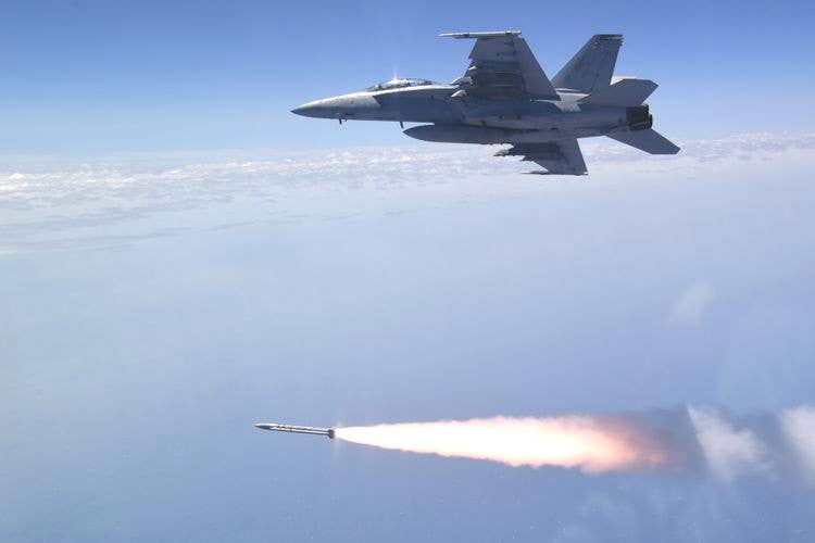A US Navy F/A-18F Super Hornet fires an AGM-88G AARGM-ER over the Point Mugu Sea Range during a test. <em>Northrop Grumman </em>