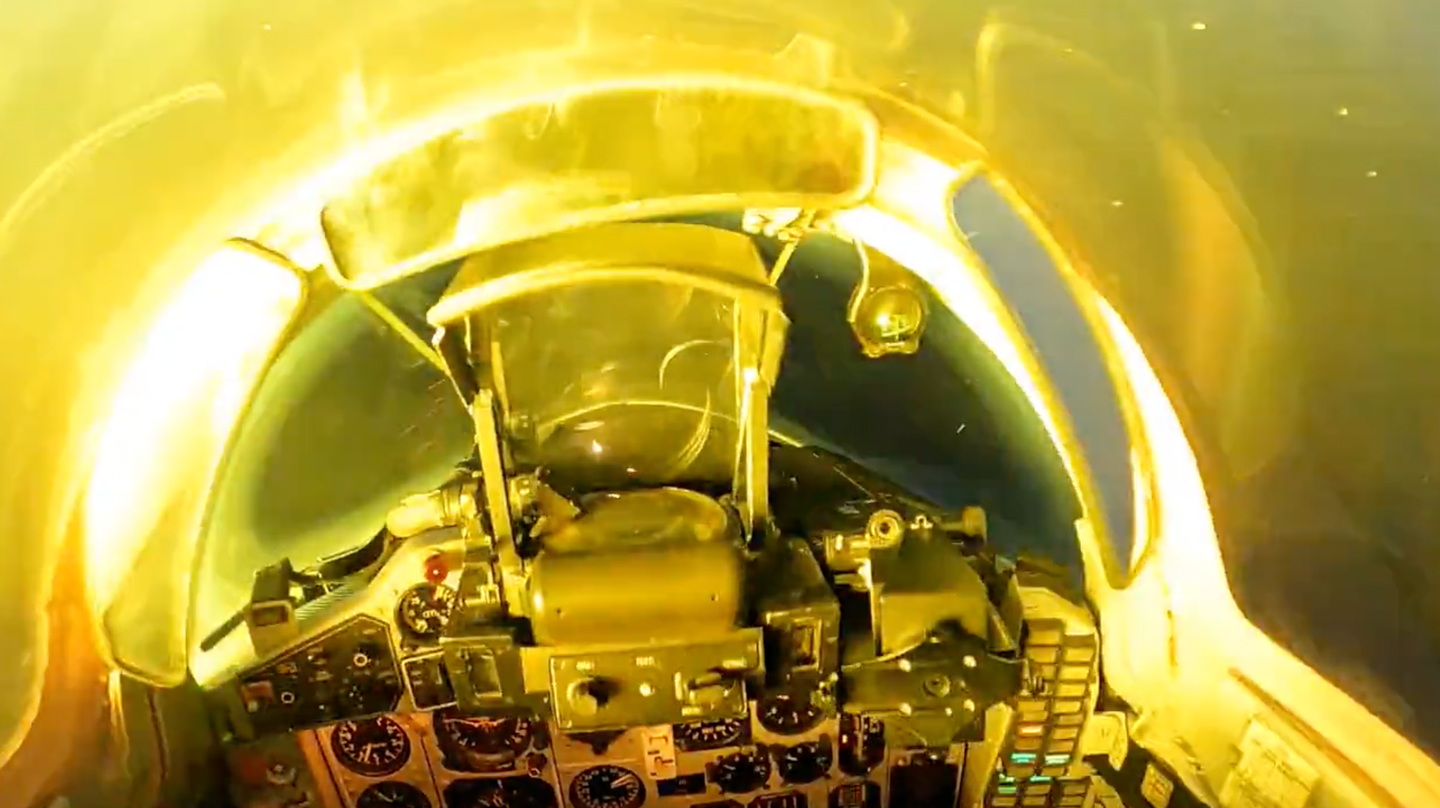 The cockpit of the MiG-29 is illuminated during a nighttime strafing run. <em>Ukrainian Air Force Screencap</em>