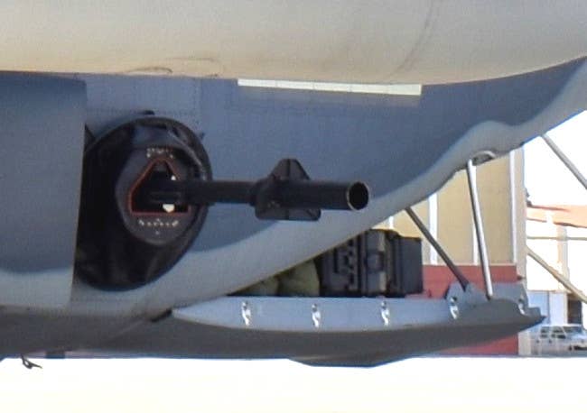 A picture of an older M102, readily identifiable by the triangular section behind the flash hider, installed on an AC-130J gunship. <em>USAF</em>