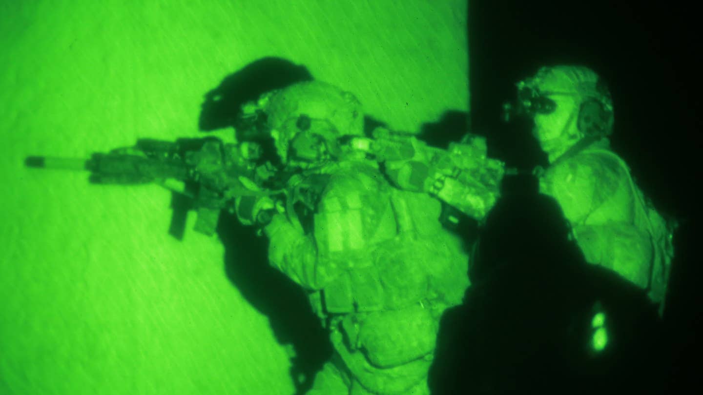 Members of the US Army's 75th Ranger Regiment conduct a nighttime training mission.
