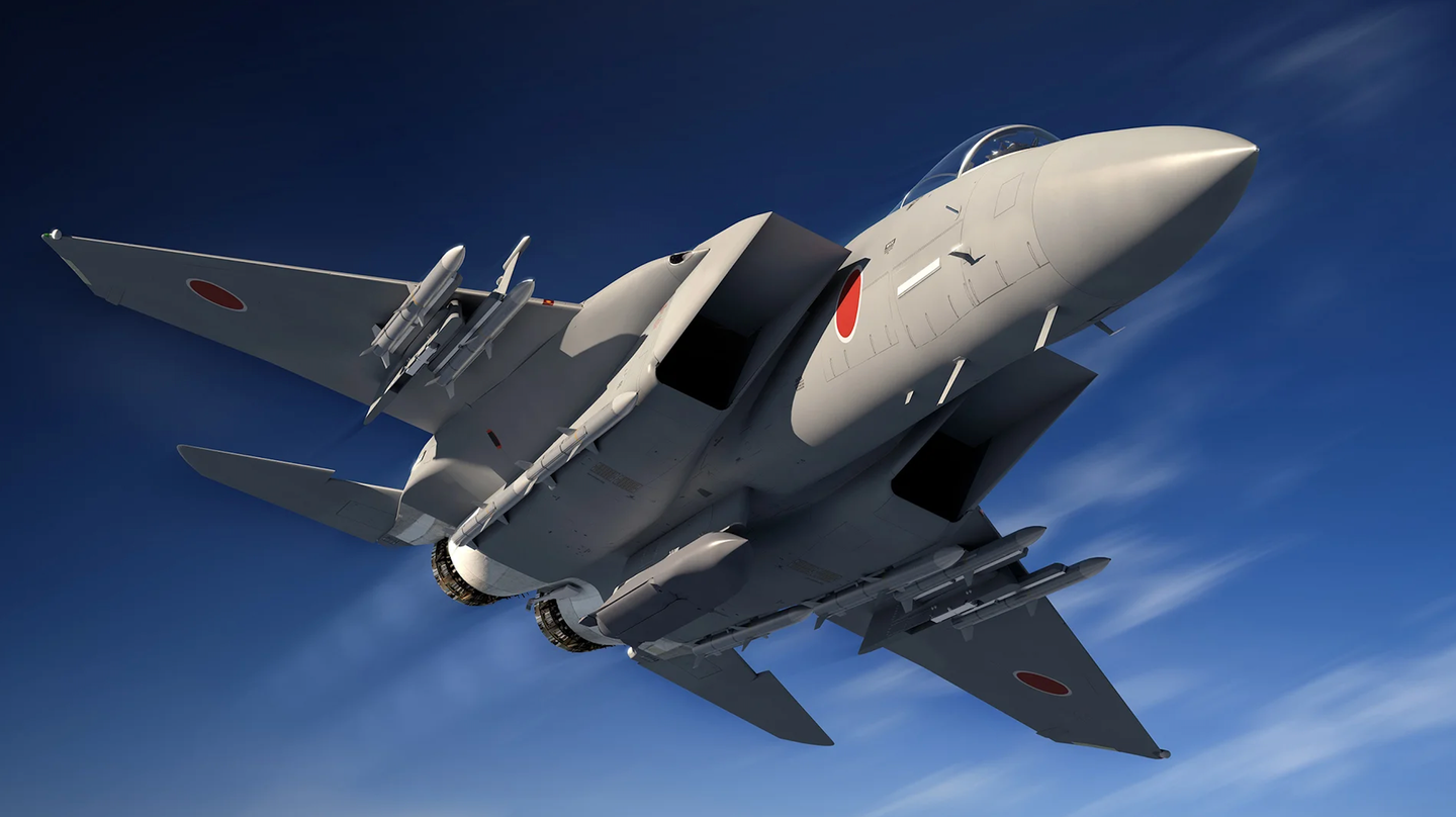 An artist’s impression of an upgraded Japanese F-15J carrying an AGM-158 Joint Air-to-Surface Standoff Missile (JASSM) on its centerline.&nbsp;<em>BOEING</em>