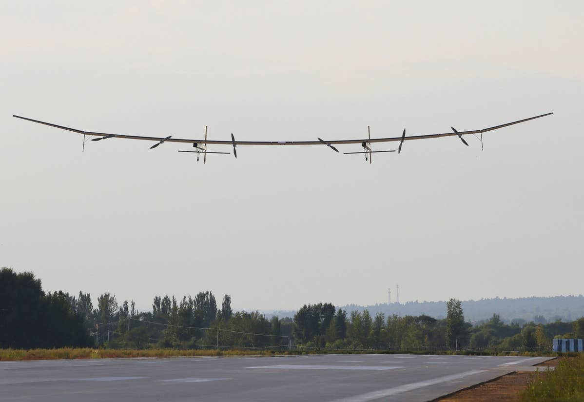 The Qimingxing 50 in flight above the runway. <em>Liu Feng/chinadaily.com.cn</em>