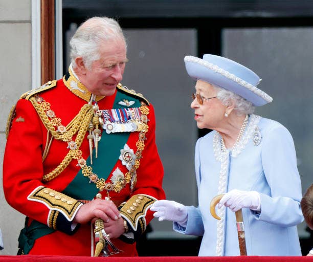 Then-Prince Charles, now the King of England (wearing the uniform of Colonel of the Welsh Guards) and Queen Elizabeth II watch a flypast from the balcony of Buckingham Palace during Trooping the Colour on June 2, 2022 in London, England. (Photo by Max Mumby/Indigo/Getty Images)